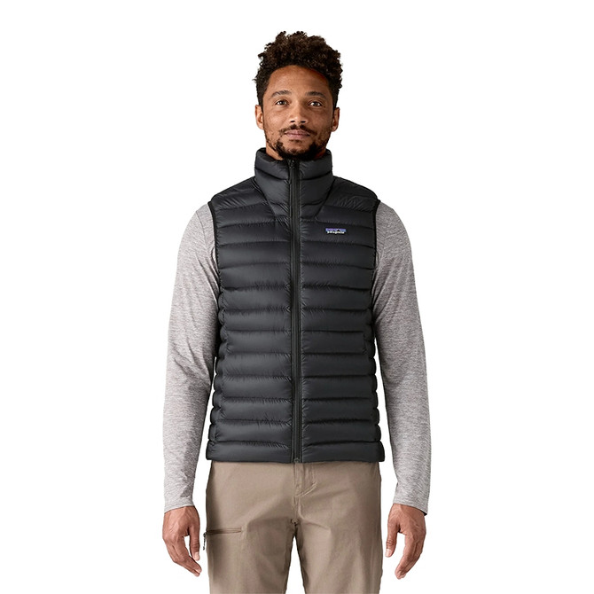 Patagonia Men's Down Sweater Vest, a man wearing a black insulated down vest with a high collar, front zip closure, and lightweight design.