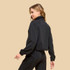 TCEC Women's Mock Neck Sweatshirt, black casual jacket with long sleeves and a stand-up collar worn by a woman against a beige background.