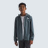 The North Face Teen Zipline Rain Jacket, a young boy modeling a lightweight waterproof gray jacket with a hood and ZIP pocket, suitable for outdoor rain protection.