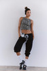 FP Movement Women's Flutter Jogger, black relaxed fit cropped joggers with white drawstring and cuffs.