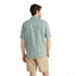 L.L. Bean Men's Tropics Short-Sleeve Shirt, light green Hawaiian-style shirt with a subtle floral pattern being worn by a man from behind.