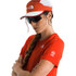 The North Face Women's Summit High Trail Short Sleeve, red technical athletic shirt worn by a female trail runner with a cap and sunglasses.
