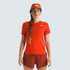 The North Face Women's Summit High Trail Short Sleeve, red athletic female model wearing a short-sleeve trail shirt with matching shorts and a red cap.