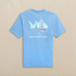Southern Tide Men's Short Sleeve Sailboat Skipjack Tee, light blue T-shirt with sailboat graphic and 'Southern Tide' text on back.