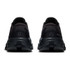 On Running Women's Cloud X 5, rear view of black athletic running shoes showcasing their cushioned soles and sleek design.