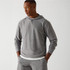 Fabletics The Cloud Jersey Hoodie, a men's grey athletic hoodie with a soft, comfortable fabric and a relaxed fit.