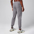 Fabletics Men's The Cloud Jersey Jogger, gray jogger pants made from lightweight, breathable fabric, featuring an elastic waistband and cuffed ankles.