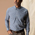 Duck Head Men's Winstead Plaid Poplin Sport Shirt, model wearing a blue and white button-down plaid shirt with a chest pocket and long sleeves