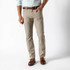 Duck Head Men's Pinpoint Canvas 5-Pocket Pants - 32" Inseam, men's casual beige canvas pants with five pockets, worn with a light blue shirt and brown shoes.