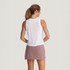 Free Fly Apparel Free Fly Women's Elevate Lightweight Tank, a woman wearing a sleeveless white tank top with a loose fit and comfortable design.