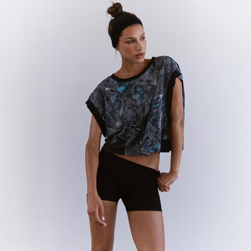 FP Movement Women's My Time Tee - Print, fashionable black and blue printed T-shirt worn by a female model in casual activewear.