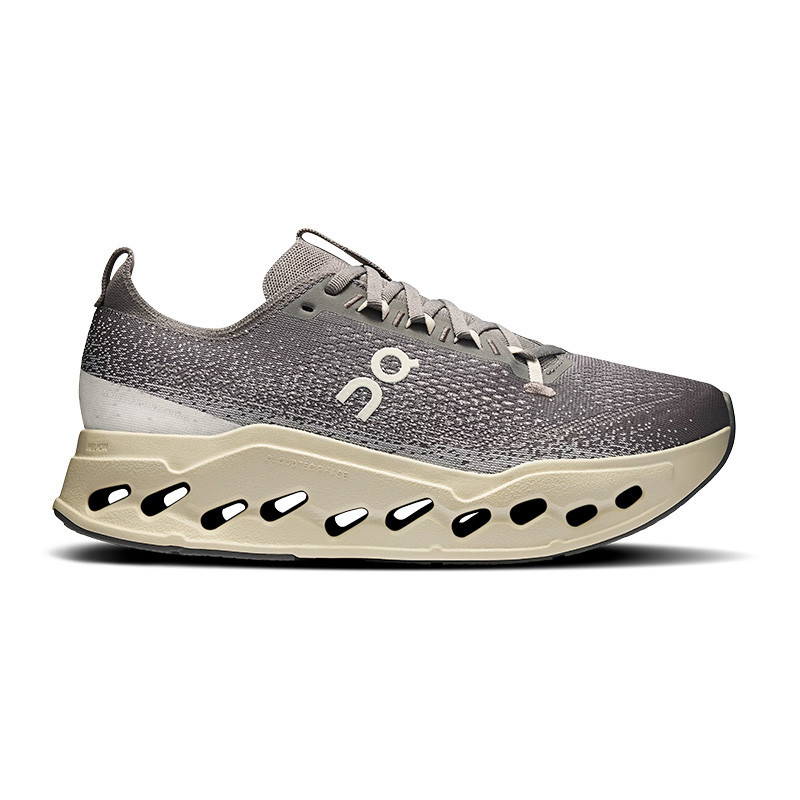 On Men's Cloudsurfer Max Running Shoes, lightweight athletic sneaker with a breathable gray and white upper, cushioned sole with unique cut-out design for enhanced comfort and support.