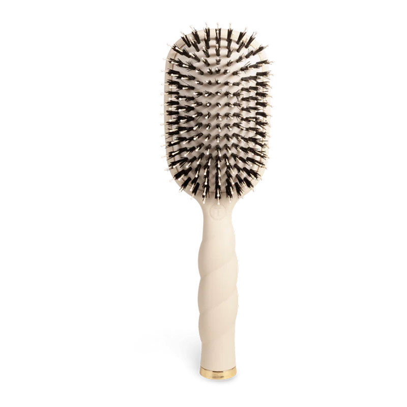 Teleties Boar Bristle Hair Brush, close-up of a natural wood-tone brush with densely packed boar bristles for gentle hair styling.