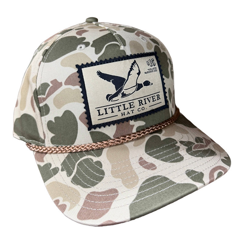Little River Hat & Clothing Co. Little River Duck Stamp Hat, camo-patterned baseball cap with patch featuring a duck and the brand's name.