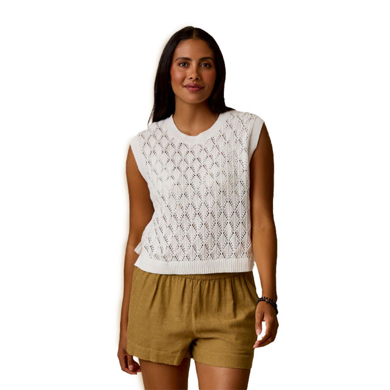 Carve Designs Carve Women's Fox Sweater, white sleeveless knit sweater with an intricate openwork pattern worn by a woman, paired with tan shorts.