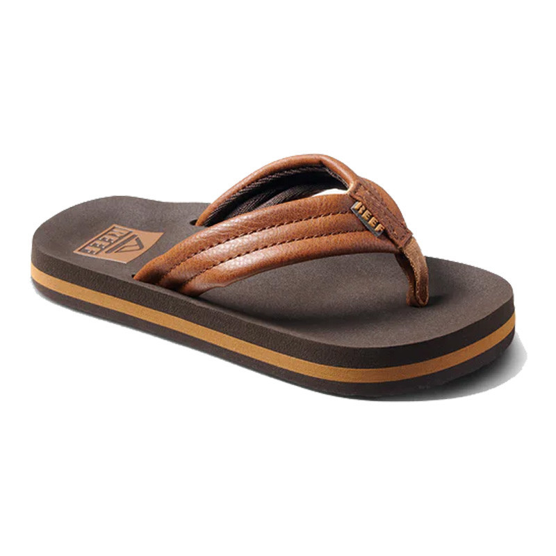 Reef Kids' Ahi Flip Flop, brown leather strap sandal with cushioned footbed and rubber sole.