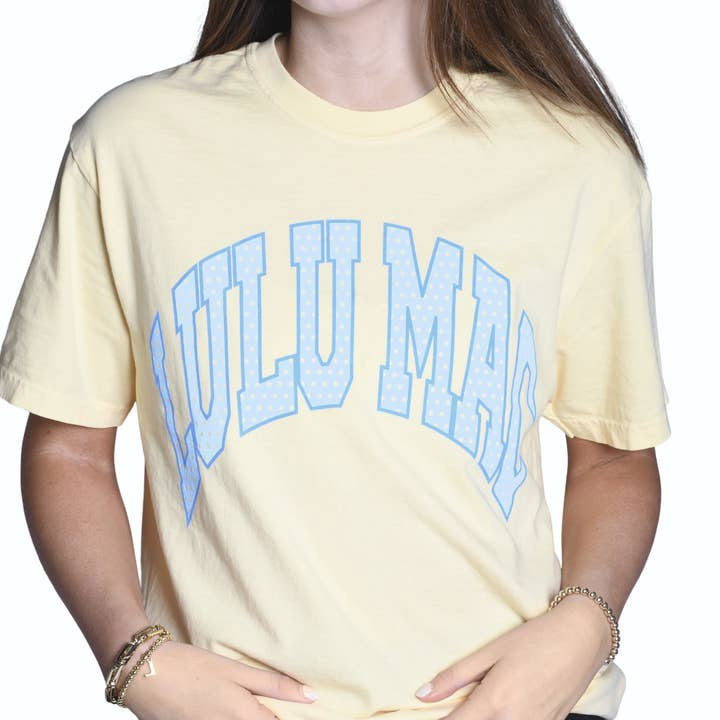 LuluMac Women's Comfort Color Polka Dot Short Sleeve T-Shirt, yellow casual T-shirt with light blue 'LOULU MAC' lettering in a curved style.