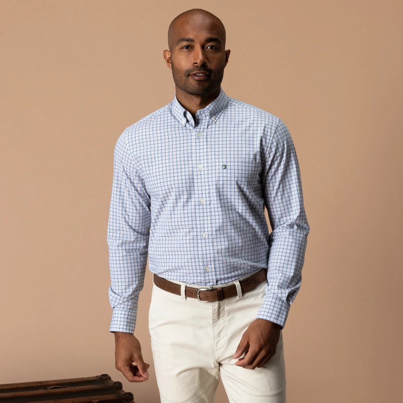 Duck Head Men's Edison Plaid Poplin Sport Shirt, model wearing a light blue and white long-sleeve button-down plaid shirt with a button-down collar and chest logo.