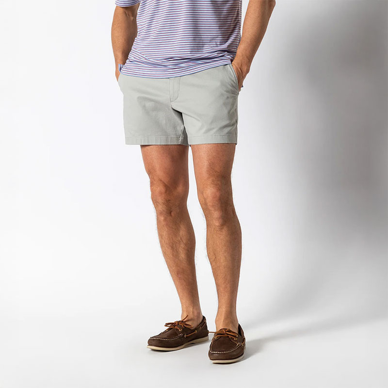 Duck Head Men's Gold School Short - 5 inch Inseam, front view of men's light gray shorts paired with a striped t-shirt and brown boat shoes.
