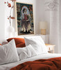 Framed mystical wolf artwork displayed in a moody room surrounded by vintage furnishings.