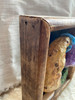 Angled view of Dreamy highlighting the dimensional clay moon face, whimsical mushroom, handcrafted details, and depth of the wooden frame.