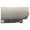 A detailed close-up shot of the manufacturing label located on the lower right side near the back. The white label contains text including "NCR CORPORATION," "Class/Model 7198-2003-9001," "Serial No. 58-43126368," and ratings like "24V 3.125A." Various regulatory logos like UL, TUV, CE, and the "10" circular symbol are lined up along the bottom.