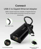 An explanatory infographic for the Belkin USB-C to Gigabit Ethernet Adapter.

The image features a central high-angle view of the black adapter with three circular green-bordered callouts highlighting its physical features:

Top Left: A close-up of the flexible black cable, labeled "6 in./15cm cable."

Bottom Left: A close-up of the connection interface, labeled "RJ-45 Ethernet port."

Bottom Right: A close-up of the USB-C plug with green arrows indicating it can be flipped, labeled "Reversible USB-C connector."

The top of the image contains the bold title "Connect USB-C to Gigabit Ethernet Adapter" followed by descriptive text: "USB-C speed meets the reliability of Gigabit Ethernet for an uninterrupted connection during your largest downloads."