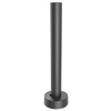 A rear-angle view of a matte black Havis mounting pole standing on a circular base. The extruded metal pole features vertical grooves, and the rounded base cover includes a small cutout or notch at the bottom for organized cable routing.