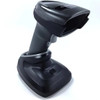 A studio shot of a Zebra DS2278 wireless barcode scanner docked in its presentation charging cradle, isolated on a white background. The handheld scanner is positioned upright with its handle inserted into the black base, which features a light gray trim around the docking port. The scanner itself is finished in twilight black with a light gray trigger and the Zebra logo visible on top of the scanner head.