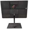 Rear view of the HP ProOne 600 G4 All-in-One PC, showcasing the textured black matte chassis with a central glossy circular HP logo, a selection of connectivity ports on the lower left, and the flat rectangular desktop stand base on a solid white background.