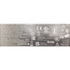 Technical specification and safety compliance label on the bottom of an NCR AC power adapter brick.