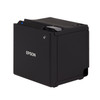 Isometric side profile view of the black Epson TM-m10 point-of-sale printer. The image highlights its compact, cube-shaped housing, smooth side paneling, a small cable routing cutout at the bottom rear corner, and the top-mounted gray release lever angled forward.