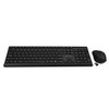A straight-on, eye-level front view of the full-sized black wireless keyboard resting on a white surface, with the wireless mouse and USB nano receiver placed closely alongside its right edge.