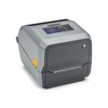 Alternative high-angle front right perspective of the Zebra ZD621d linerless desktop printer, focusing on the compact footprint, smooth plastic housing, front dispenser layout, and bright orange media door release mechanism.