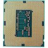 Close-up underside view of an Intel LGA 1150 processor showing a grid pattern of gold-plated land contact pads across a green substrate base, surrounding a dark rectangular center section populated with small surface-mounted capacitors, resistors, and a "002" label designation.