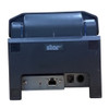 Rear view of a dark gray Star Micronics TSP654IISK thermal linerless label printer, showing the prominent Star branding logo and lower connectivity interface panel.