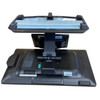 Rear view of the NCR CX7 point-of-sale hardware separated from its primary stand base, showing the mounting bracket mechanism, integrated customer display, and structural chassis layout.