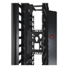 Close-up of an APC NetShelter AR8681 connector accessory bracket installed midspan inside a black 6-inch wide double-sided vertical cable management rack channel.