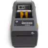 Front straight-on view of Zebra ZD411d direct thermal printer highlighting control buttons, status icons, and media output slot.