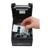 Top view of the black Citizen CT-S310II receipt printer open with a hand servicing the interior media compartment and cutter mechanism.