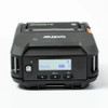 Top-down view of the Brother RuggedJet mobile printer highlighting the backlit LCD status screen, power button, and navigation keys.