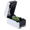 High-angle side view of the Brother TD-2350D desktop label printer with its top cover open, revealing the internal media roll bay and green adjustable guides.