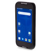 A studio product shot on a clean white background showcasing the black Datalogic Memor 11 mobile computer terminal from a three-quarter perspective. The device stands vertically, angled toward the left to highlight the sleek thickness and clean lines of its right-side profile casing. The illuminated 5-inch display features an active Android interface with a blue home wallpaper, a Google search bar, and various app shortcuts. A white "DATALOGIC" logo is visible on the top bezel, and "memor 11" is embossed on the bottom chin.