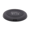 Rear-angled view of the black wireless charging pad showing the Micro-USB input port and regulatory specification label.