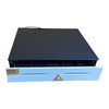 Top-angled view of the closed cash drawer with the front face and key lock centered, showcasing its matte black heavy-duty steel top enclosure.