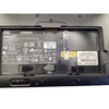 Close-up view of the tablet's rear compartment showing regulatory certification labels, part number 8204228, serial number, and MAC address tags.