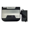 Top-down view of the FEC BP-864 point of sale PC box and its matching power brick with attached cable.