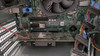 Close-up interior view of the server's motherboard expansion slots, PCIe card, SATA data cables, and system components.