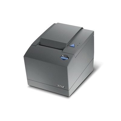 A three-quarter studio shot of a Toshiba 4610-1NR SureMark single-station thermal receipt printer in Iron Grey. The printer has a compact, boxy design with a matte dark charcoal finish.

Key Visible Features:

Top Panel: A large, rectangular flip-top cover for paper loading dominates the top. To the right of the paper path, there is a blue triangular feed button and two small LED status indicator lights.

Front Section: The front face features a blue circular latch or dial near the top right and a small silver model/serial number plate at the bottom right corner.

Paper Exit: A narrow horizontal slot is visible at the front of the top cover where the receipts are dispensed.

Build: The unit consists of a two-part plastic chassis with a visible seam running horizontally around the middle.

The printer is clean and shown at a slight downward angle against a solid white background with a soft shadow cast to the right.