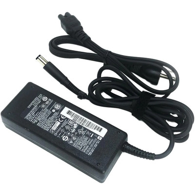 An HP laptop charger kit isolated on a clean white background. The image features a large, rectangular black AC power adapter brick with a prominent white specification label showing a barcode and numerous regulatory safety symbols. An attached black DC power cable extends from the lower right of the brick, looped and bound tightly with a black fabric hook-and-loop strap, terminating in a straight, large cylindrical barrel connector tip with a hollow center. Positioned above the brick is a separate, neatly bundled black AC wall power cord with a 3-prong plug on one end and a cloverleaf connector on the other.